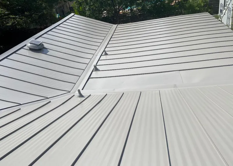 Solar attic fan installed on a metal roof for Roof Ventilation in Escalon